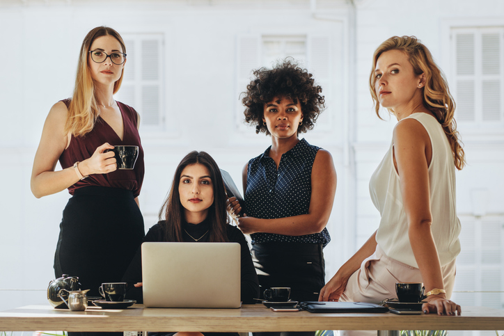 Influential Leaders in the Cannabis Field - Image of four women in a proffesional setting, looking straight at the camera.