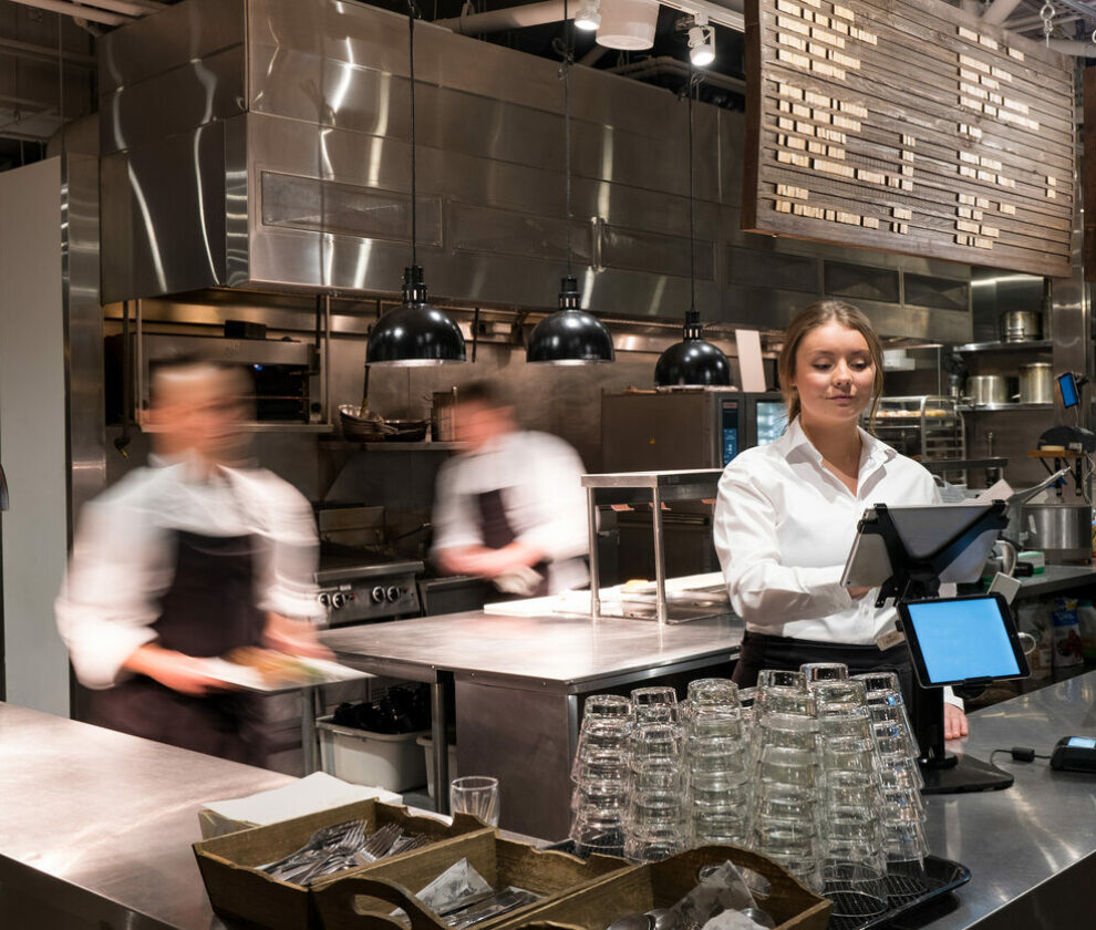 Waitress adding a new order with a tablet