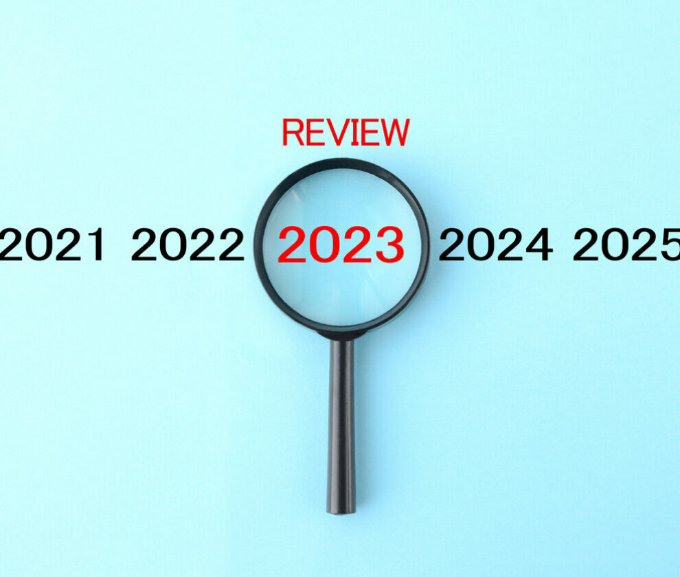 Magnifying glass and annual number 2023 with REVIEW word